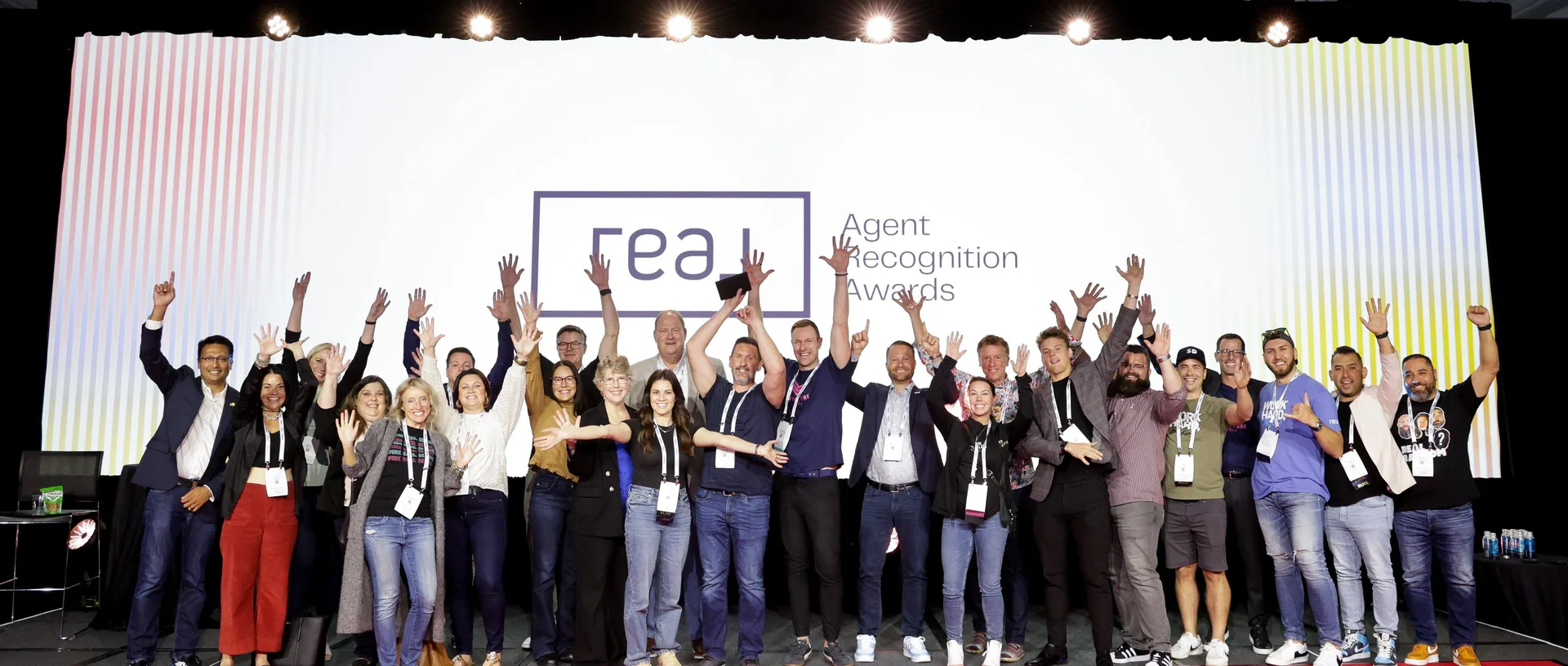 Real agents celebrating together at RISE