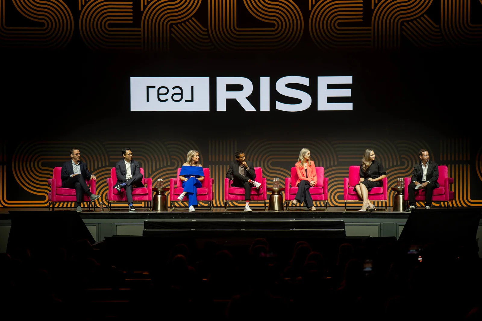 Real leaders and agents sharing ideas during a RISE panel